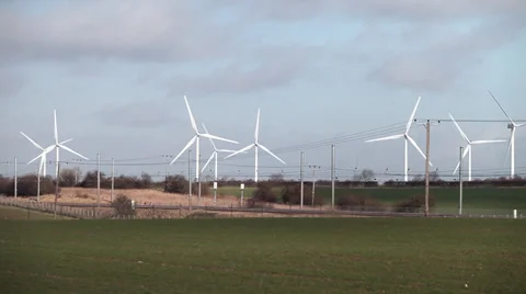 Train passing wind farm Stock Footage 34312037