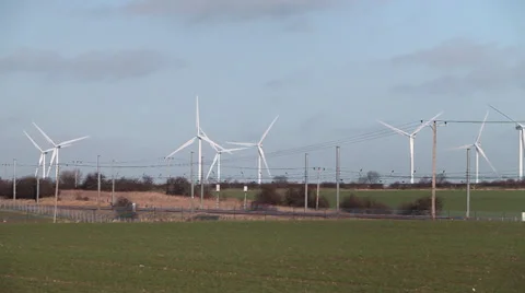 Train passing wind farm Stock Footage 34313264