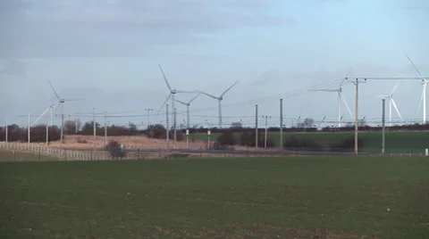 Train passing wind farm Stock Footage 34314172