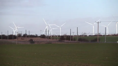 Train passing wind farm Stock Footage 34314220