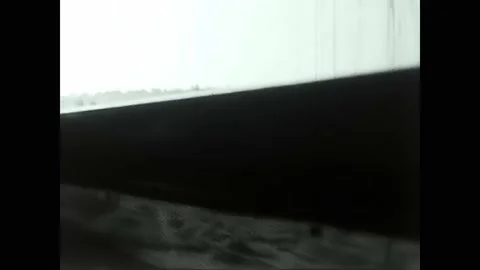 Train with people looking out the window in black and white 60s travels Video stock 195985227