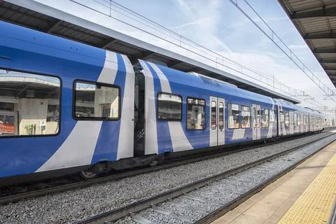 Train on platform at the railway station. Stock Photos