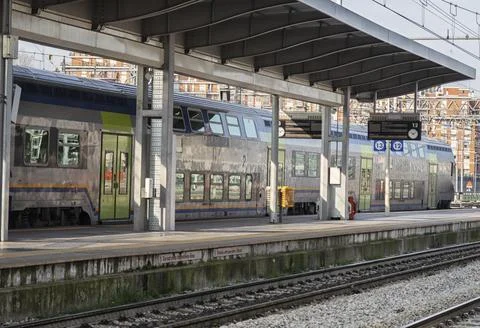 Train on platform at the railway station. Stock Photos