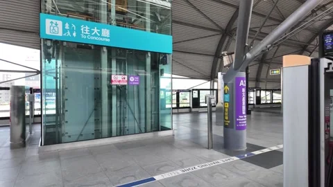 A train platform stands empty at a modern transit station. Stock Footage 333662740