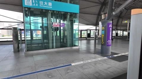 A train platform stands empty at a modern transit station. Stock Footage 333662780