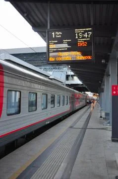 The train on the platform at the train station on a warm evening Stock Photos