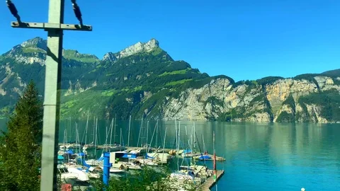Train Point of View with Mountain and Alpine Lake Vídeos de archivo 115766581