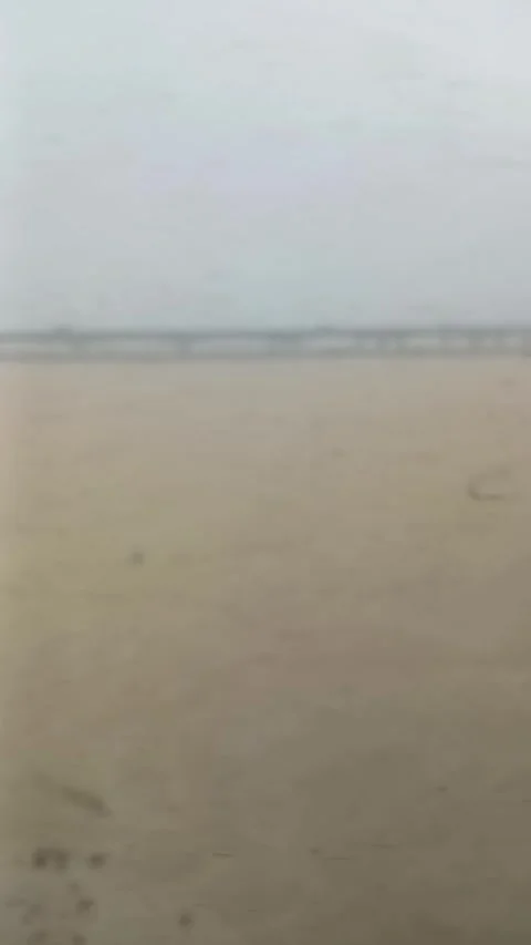 Train POV of concrete bridge over vast sandy riverbed near Cuttack, India Stock Footage 336535693
