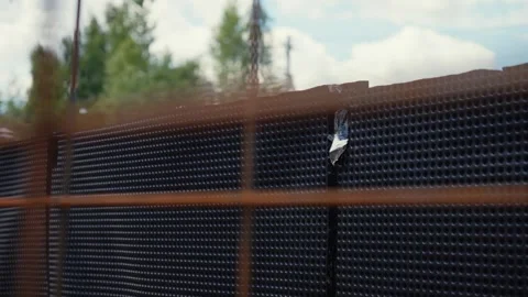 Train pov window view passing a construction site fence Stock Footage 341294451