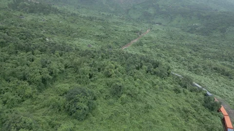 Train Powers Around Uphill Curve On The Hai Van Pass in Vietnam While Stock Footage 256876301