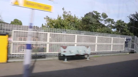 Train pulling away from Lewisham station Stock Footage 93866839
