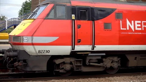 Train pulling up at a city station platform in England, UK. Stock Footage 93932132