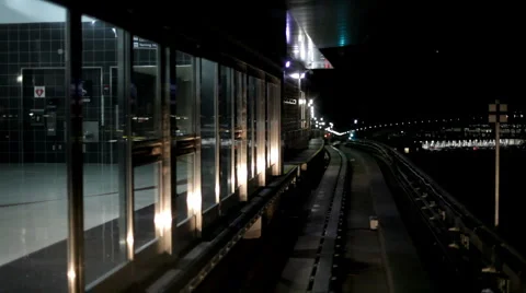 Train pulling out of station at night Stock Footage 1138919