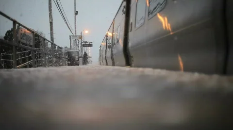 Train pulling into station in winter 動画素材 587891