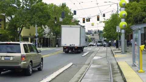 Train pulling up to a stop in downtown Seattle Stock Footage 73493975