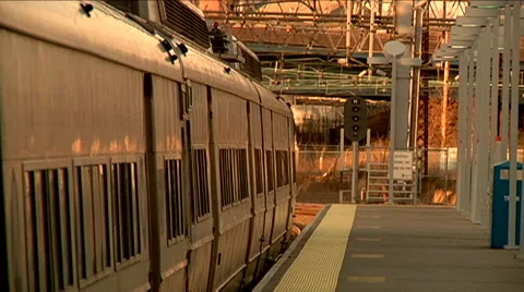Train pulls away from station toward camera goes by, passenger electric Stock Footage 45869661