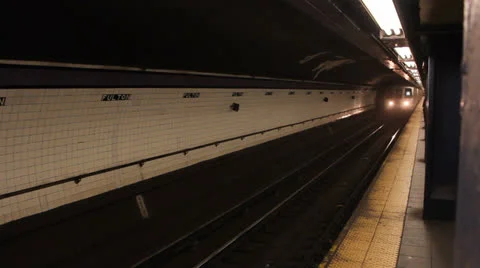 An A Train pulls into a New York City subway station Stock Footage 25681867