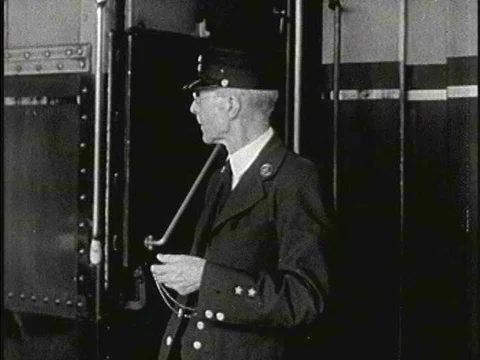The train pulls out of the station, driven by the engineer Mr. Schroeter. Stock Footage 75277458