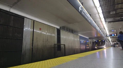 Train pulls into station, commuters get on Stock Footage 44266656