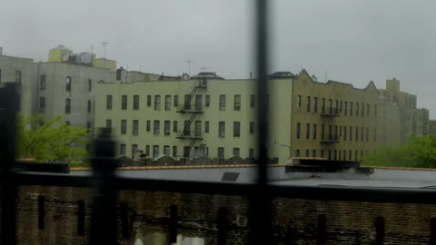 Train pulls into station view of city from window Stock Footage 277424129