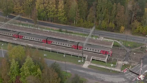 The train pulls up to a stop. air view. High quality 4k footage Stock Footage 194972926