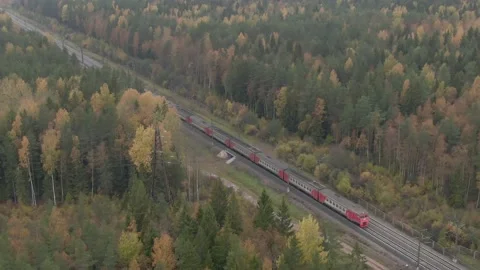 The train pulls up to a stop. air view. High quality 4k footage Stock Footage 194972946