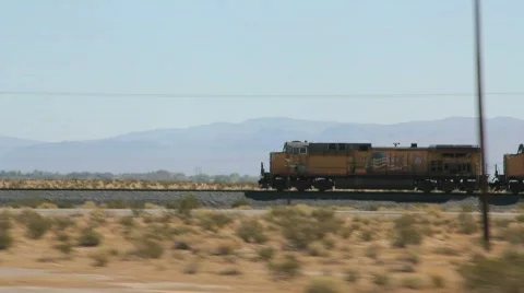 Train Races through the Desert Stock Footage 865973
