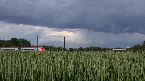 Train rail on west coast line England with wheat field in foreground 4k UK Stock Footage 111234375