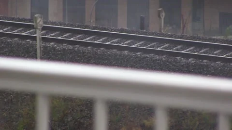 TRAIN RAIL WHILE RAINING Stock Footage 94759652