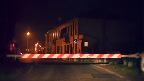 Train railroad level crossing at night Stock Footage 148056979