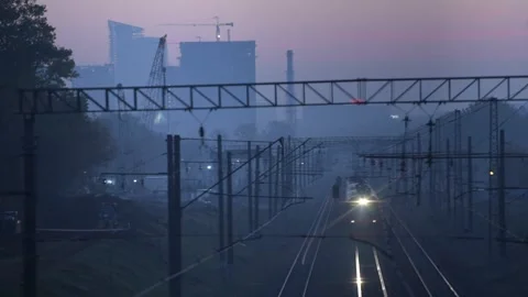 Train on railroad passing by in the dawn Stock Footage 143331451