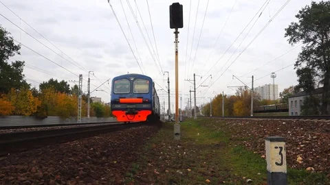 Train on the rails in autumn day Stock Footage 82356575