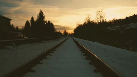 Train rails with snow at sunset Stock Footage 92365338