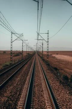 Train rails: Symbolic paths that stretch into the horizon, embodying advent.. Stock Photos