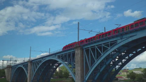 Train on railway on bridge over river Stock Footage 145694991