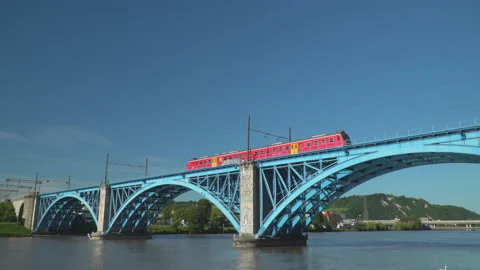 Train on railway on bridge over river Stock Footage 145783512