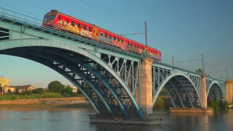 Train on railway on bridge over river Stock Footage 145793015
