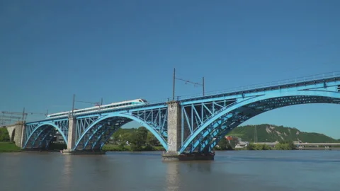 Train on railway on bridge over river Stock Footage 145820712