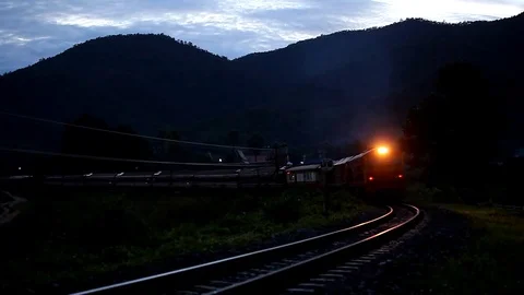 Train on railway bridge at sunset Stock Footage 79886226