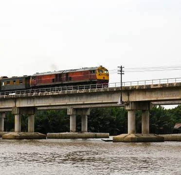 Train ran on bridge over the river Stock Photos