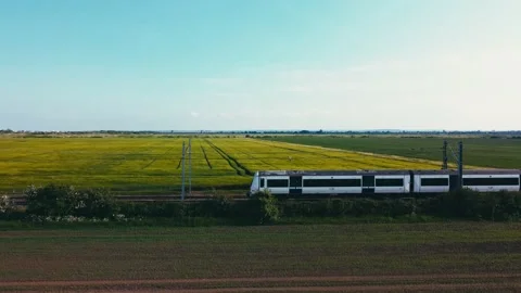 Train reverse tracking drone shot, bright sun, 4K Stock Footage 168948811