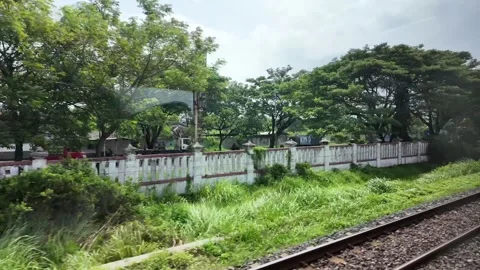 Train ride through landscapes on Java Island in Indonesia Stock Footage 336946566