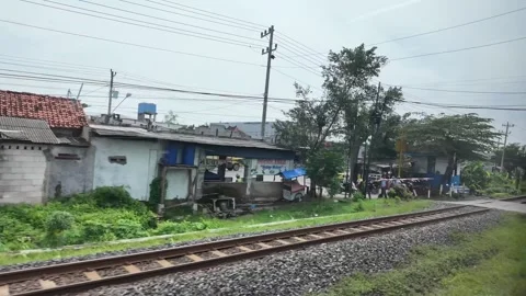 Train ride through landscapes on Java Island in Indonesia 스톡 동영상 336946714