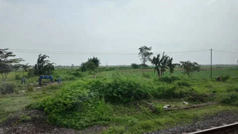 Train ride through landscapes on Java Island 스톡 동영상 336947424