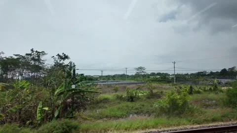 Train ride through landscapes on Java Island 스톡 동영상 336947439