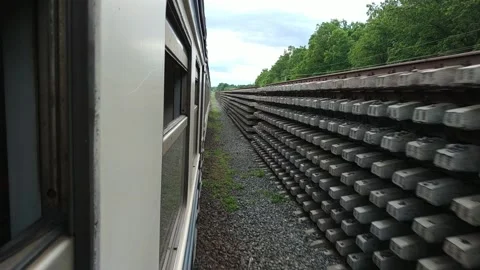 Train ride, view from window. Old train passing rails warehouse. Stock Footage 120006581