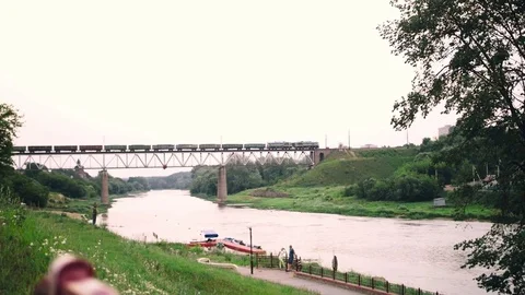 Train rides across the river on the bridge Stock Footage 71229559
