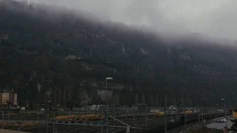 The train rides against the background of the cliff Switzerland Stock Footage 77842490