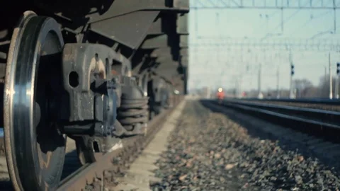 Train rides on the background of metal wheels on the tracks Stock Footage 125136067
