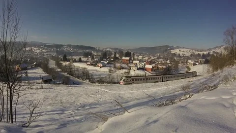Train rides in the mountains in winter Stock-Footage 84109915